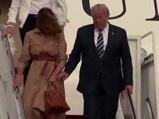 Awkward video shows Trump repeatedly trying to hold Melania’s hand
