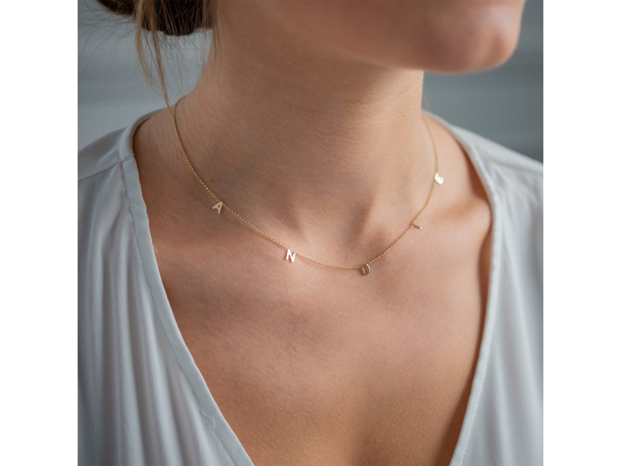 Decorate your décolletage with this dainty letter necklace