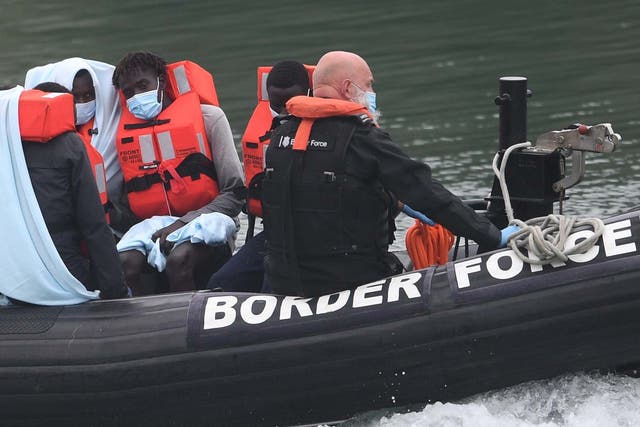 A Border Force vessel brings in migrants found off the coast of Dover on 14 August 2020