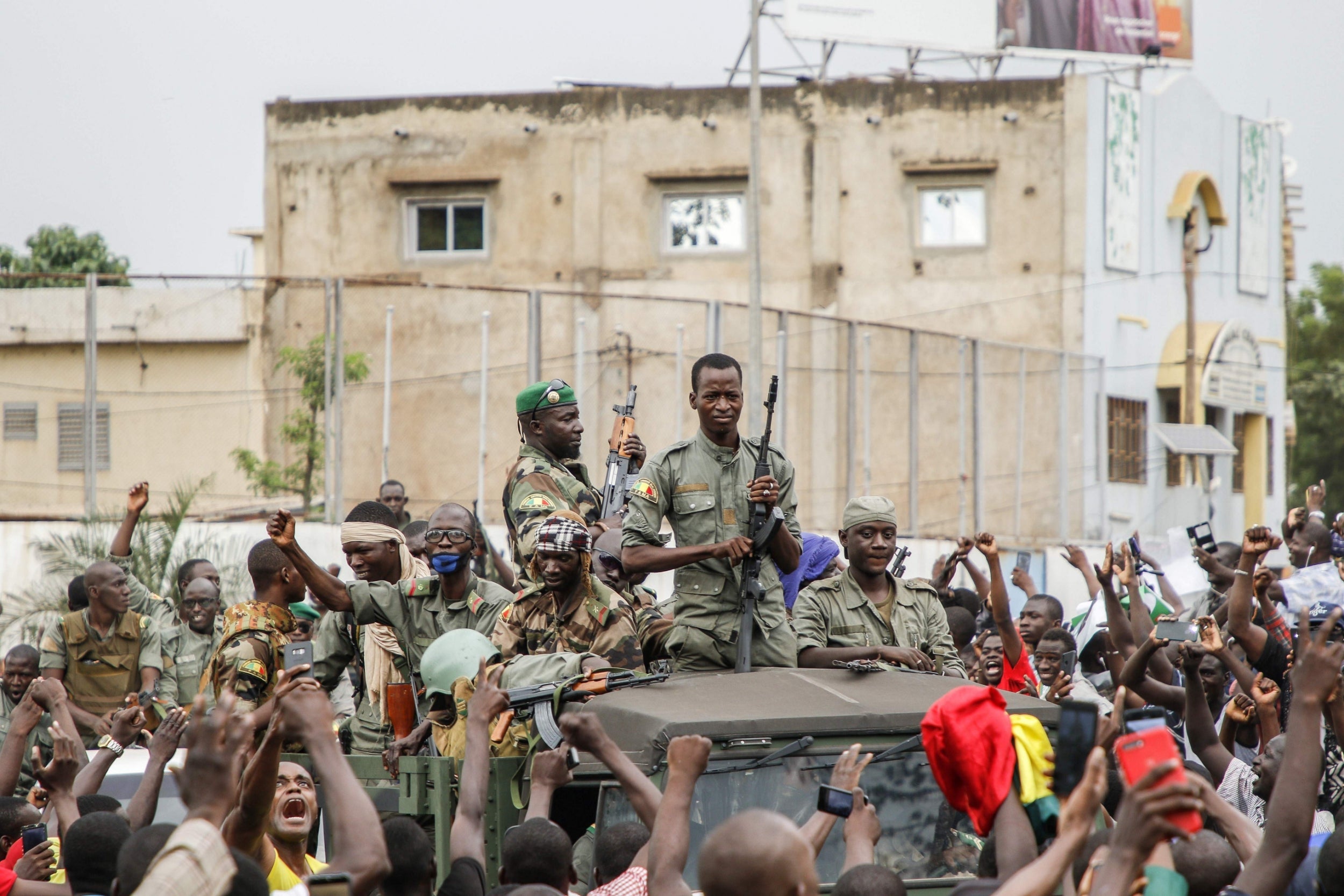 Malian armed forces are cheered on as they parade at Independence Square in Bamako after rebel troops seized the president (AFP/Getty)