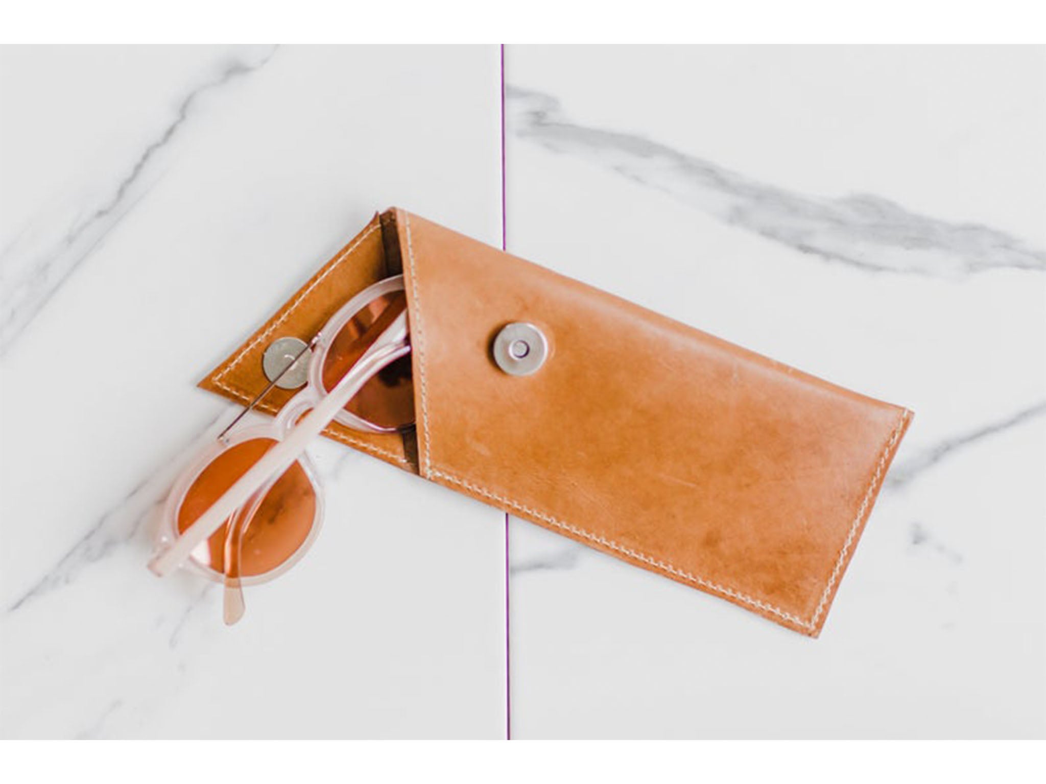When you're not wearing them, keep your glasses safe in this leather pouch