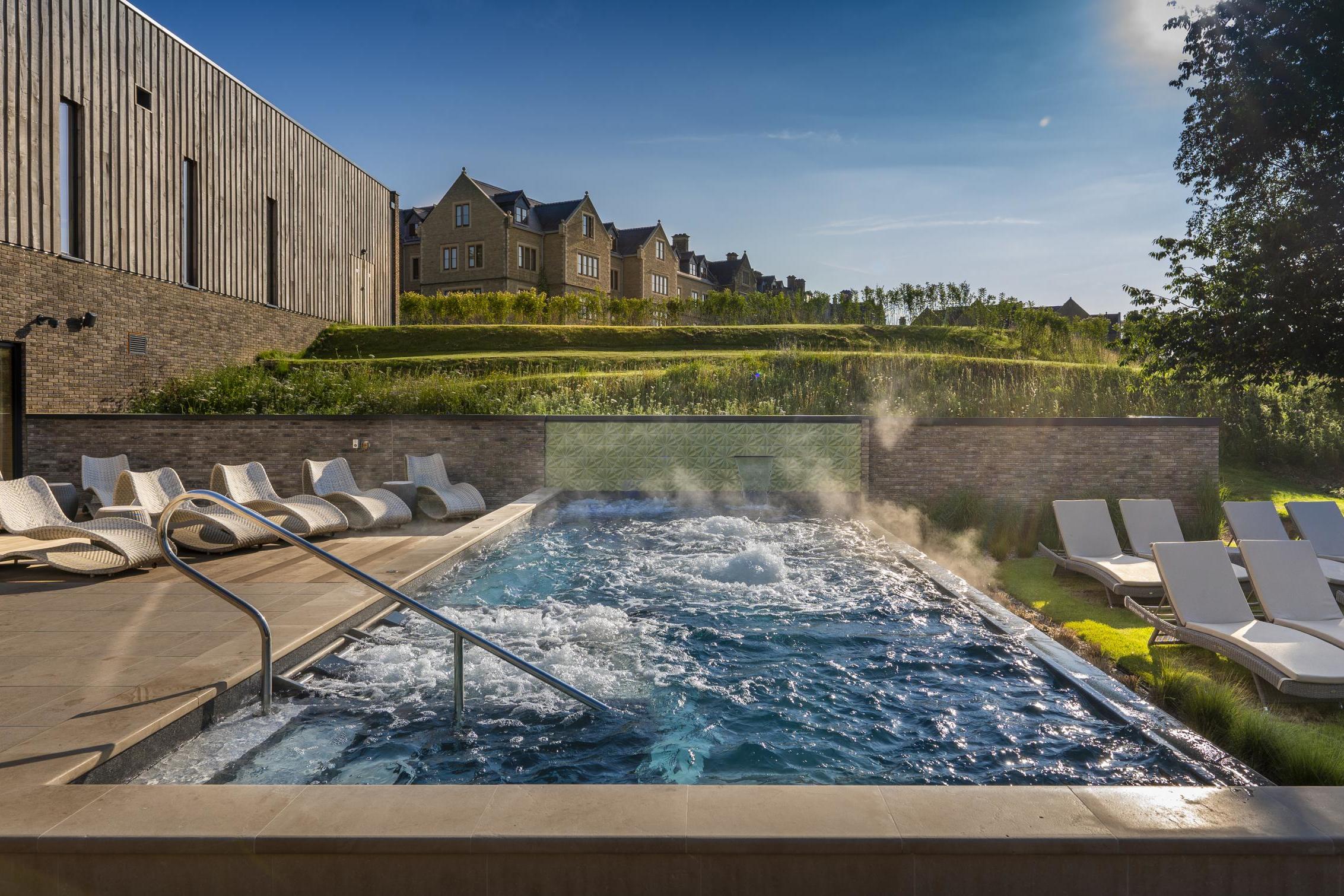 South Lodge in Horsham, West Sussex, features an indoor infinity pool, outdoor hydrotherapy pool, and a wild-swimming pond