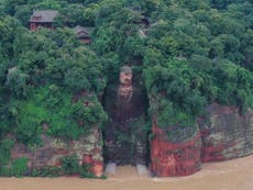 Floodwaters wet toes of Chinese giant Buddha, fulfilling local legend