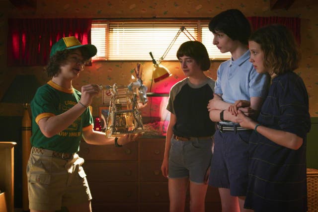 Gaten Matarazzo, Noah Schnapp, Finn Wolfhard, and Millie Bobby Brown in season three of 'Stranger Things'.