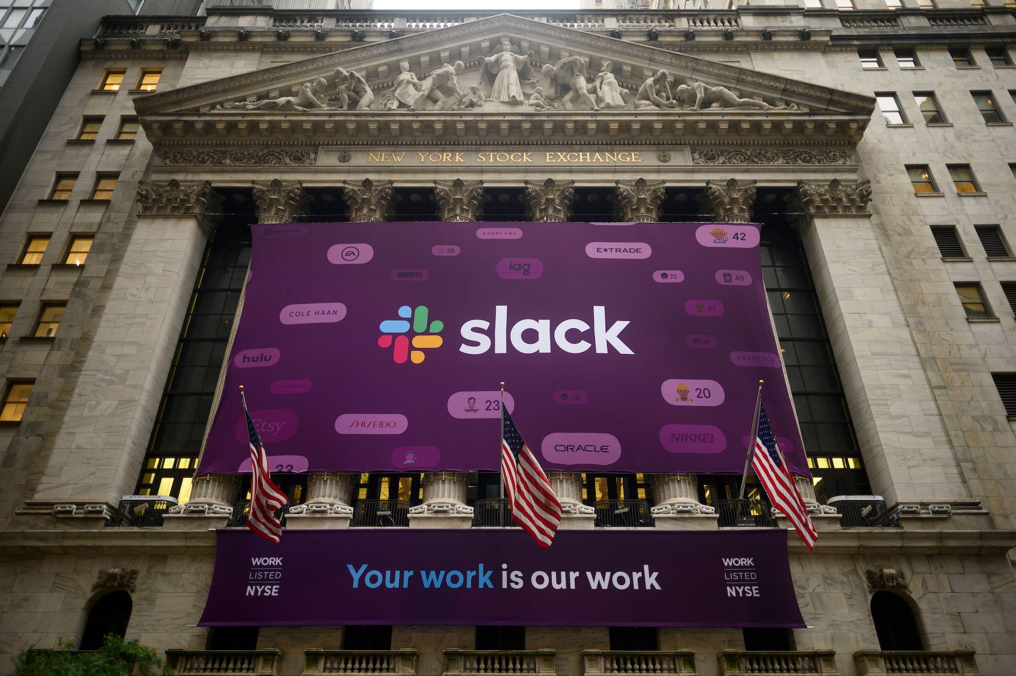 The logo of the Slack Technologies Inc. is seen outside the New York Stock Exchange (NYSE) after their company public offering (IPO) on June 20, 2019 located at Wall Street in New York City