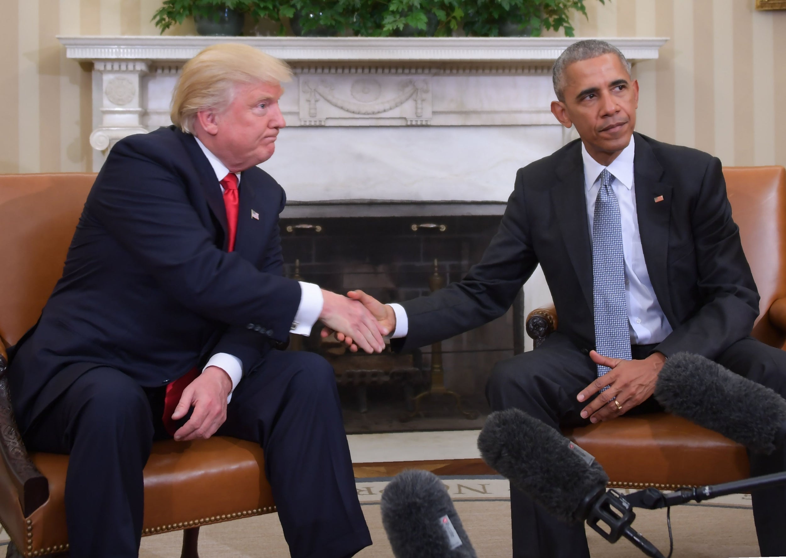 An uneasy handshake between Donald Trump and Barack Obama during the transition between their presidencies