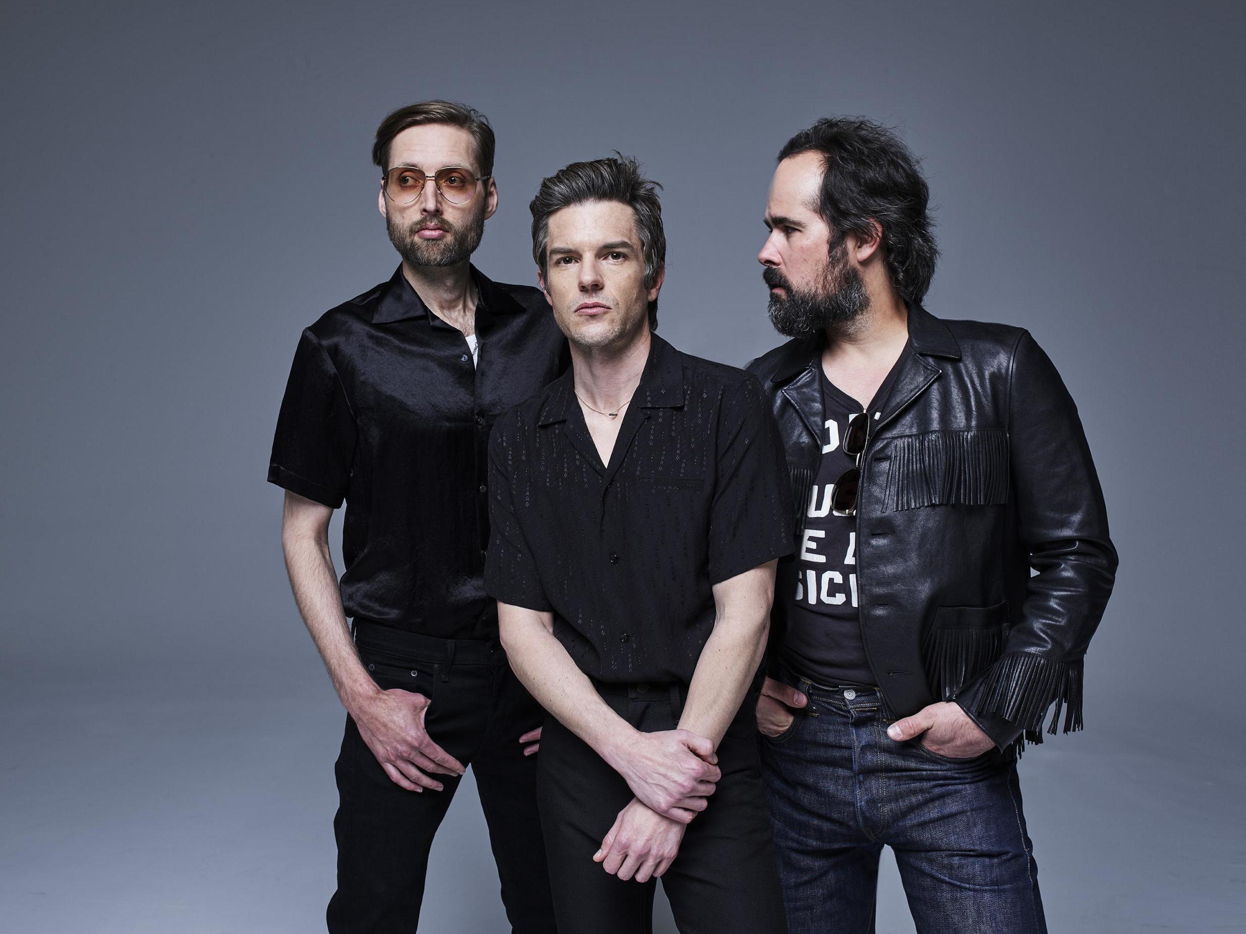 The Killers (from left, Mark Stoermer, Brandon Flowers and Ronnie Vannucci) embrace contemporary alt-pop influences on their new album ‘Imploding the Mirage’