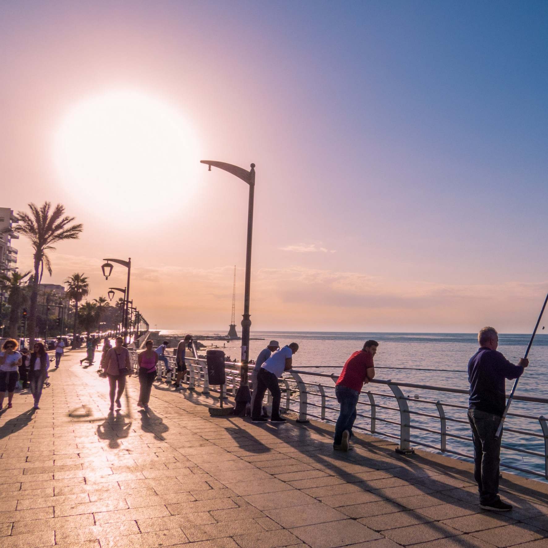 Fishermen at sunset on the Corniche Promenade