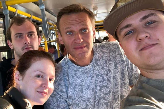 In one of the last photos taken before his alleged poisoning, Alexei Navalny (centre) poses for a selfie alongside his press secretary Kira Yarmysh (foreground left), on their way to board an aircraft at Tomsk airport in Siberia