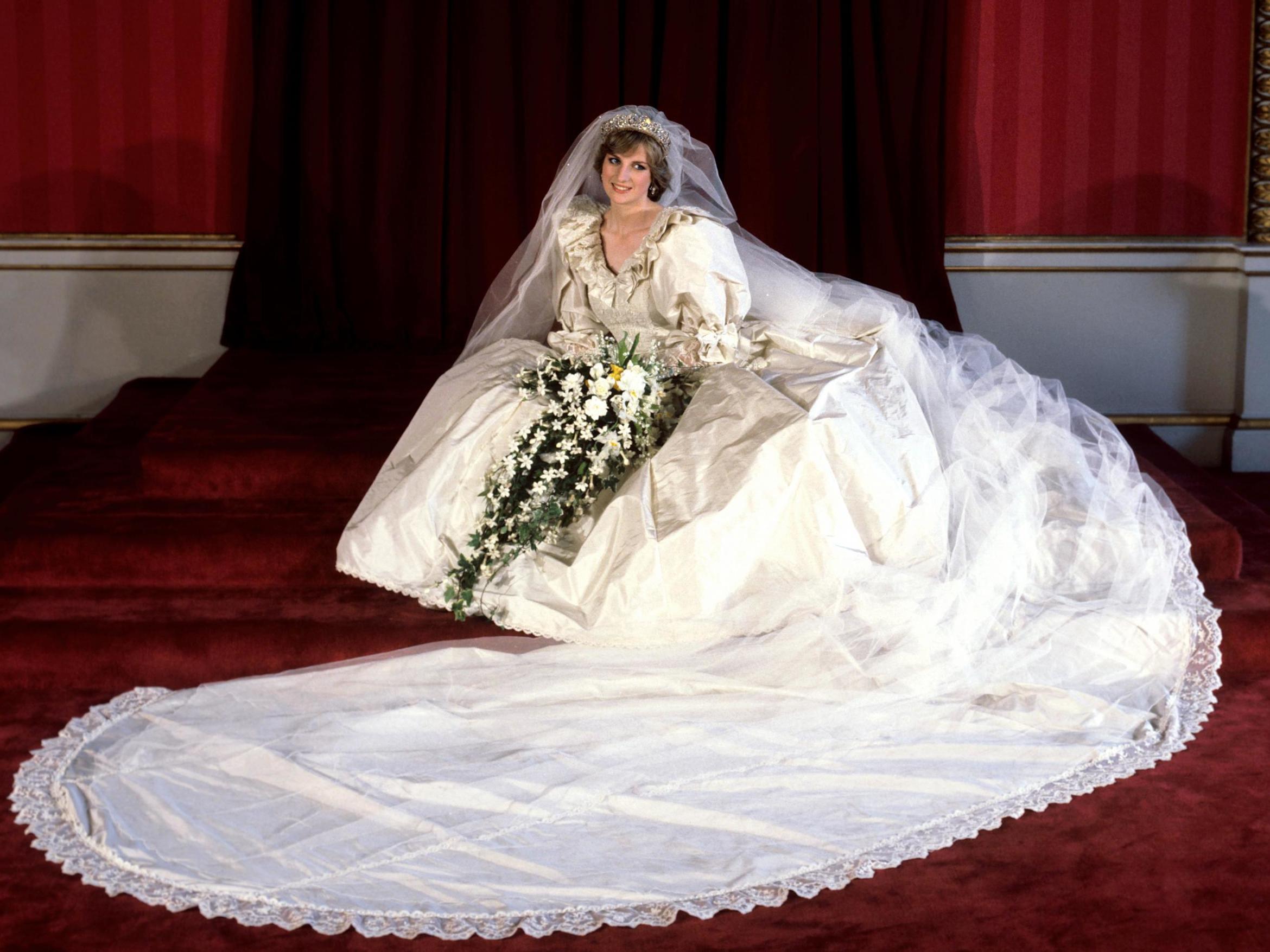 The Princess of Wales seated in her bridal gown at Buckingham Palace after her marriage to Prince Charles at St. Paul's Cathedral