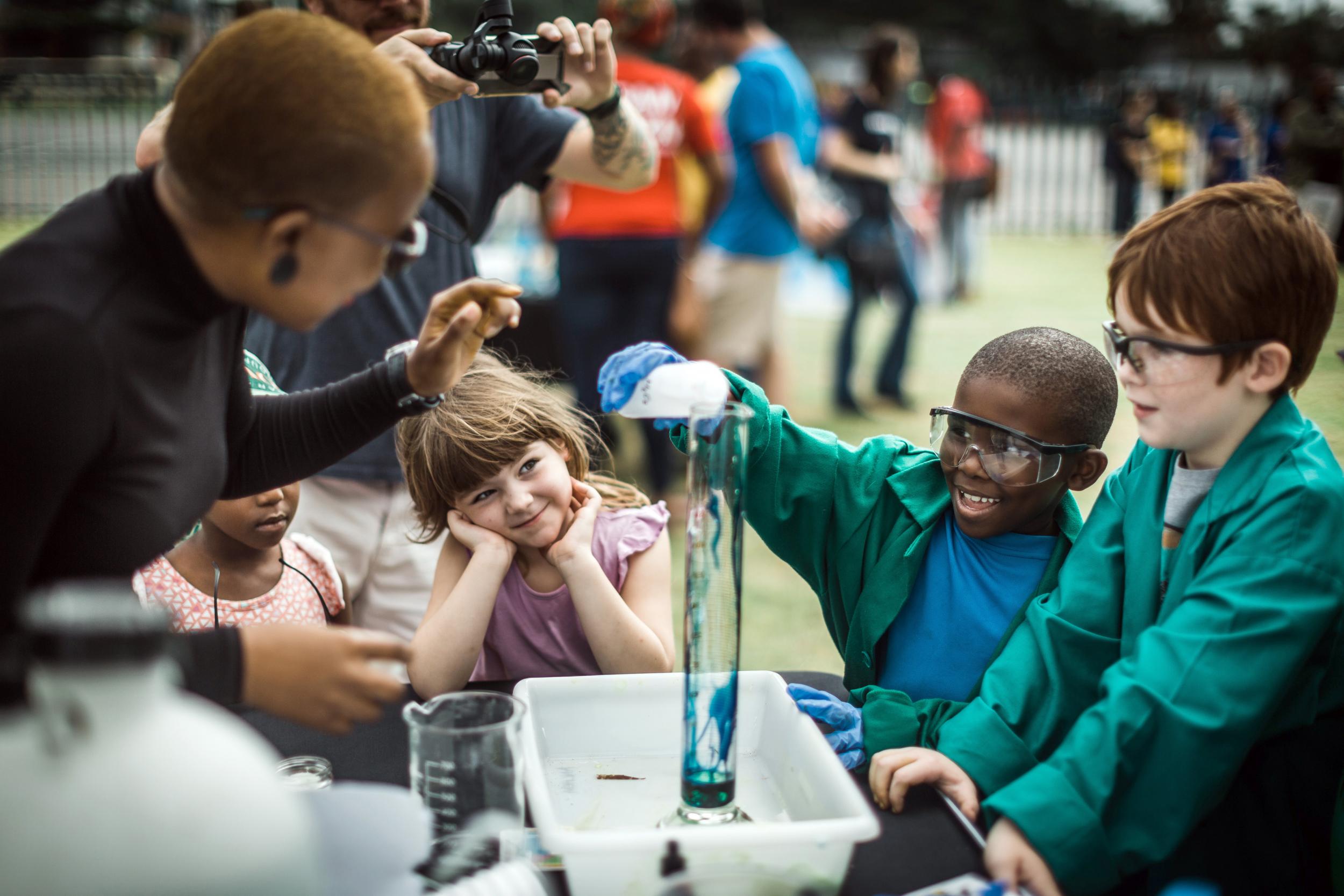 Children take part in an experiment called ‘Elephant Lips’ during the March for Science in Durban in 2018