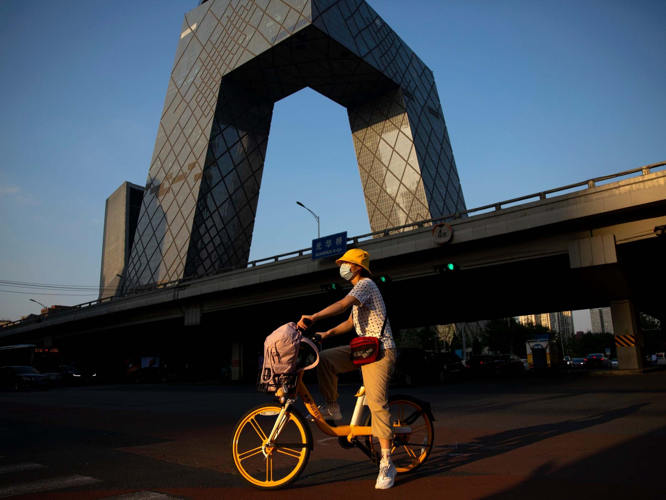 A woman wearing a face mask to protect against the coronavirus in the central business district in Beijing
