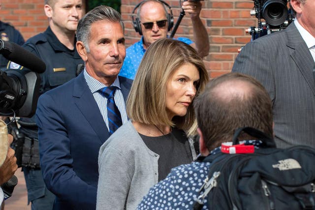 Lori Loughlin and Mossimo Giannulli exit the Boston Federal Court house after a pre-trial hearing on 27 August 2019.