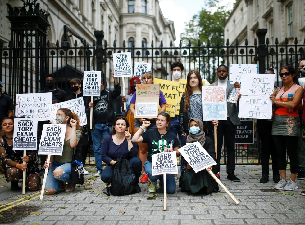 People take part in a protest over the governments handling of exam results outside Downing Street