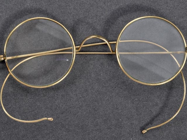 A pair of Gandhi's glasses have sold for tens of thousands of pounds in an auction