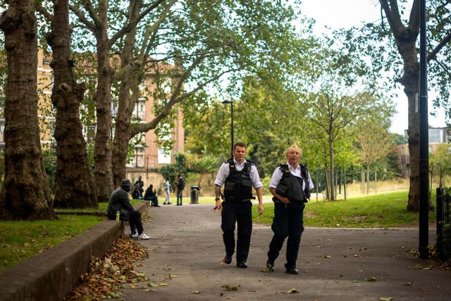 Police seen in Nursery Row Park, Walworth, where a 24-year-old man is believed to have been stabbed on Friday