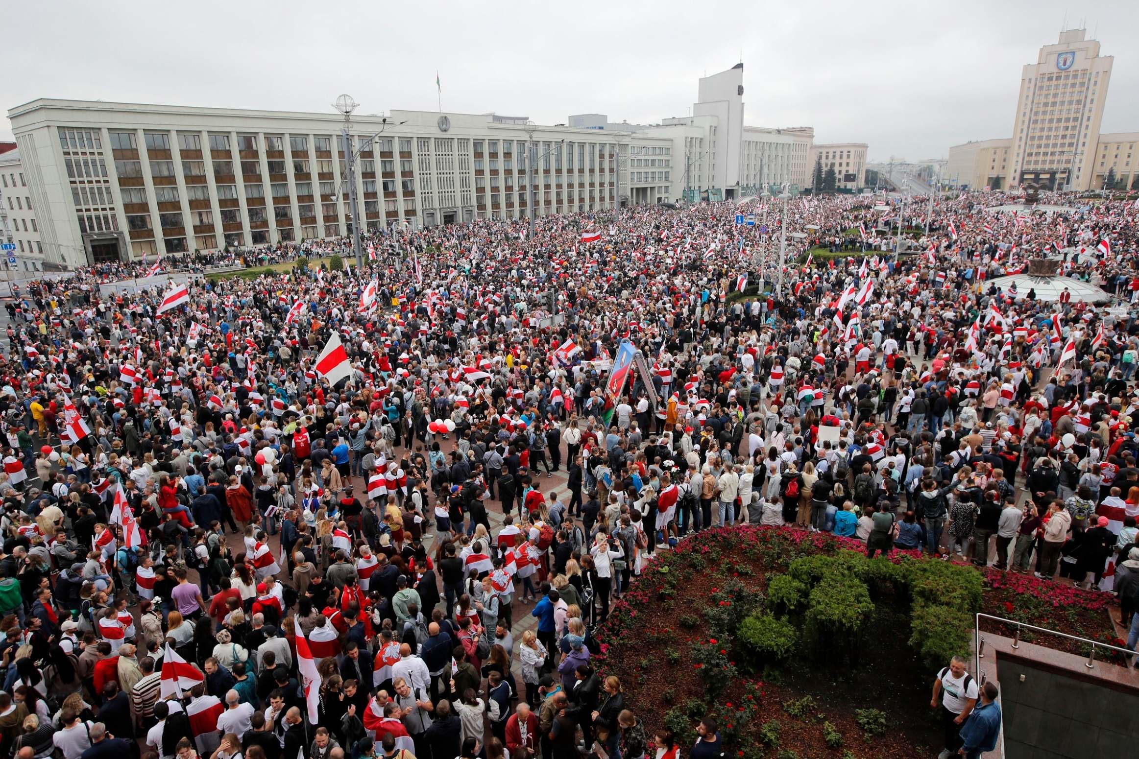 People attend an opposition demonstration to protest in Minsk on Sunday