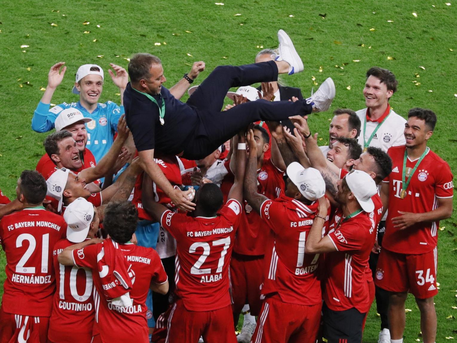 Bayern players celebrate with coach Hansi Flick