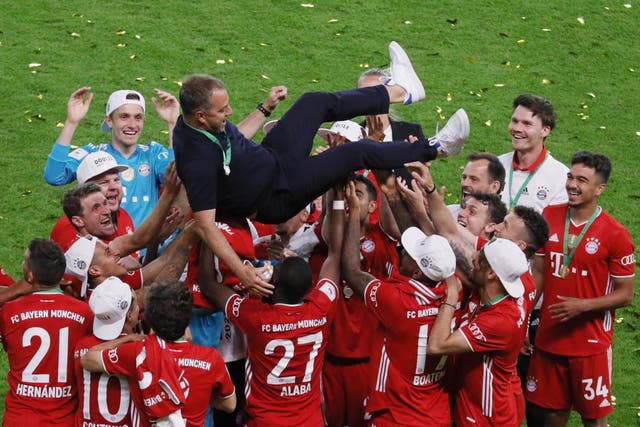 Bayern players celebrate with coach Hansi Flick