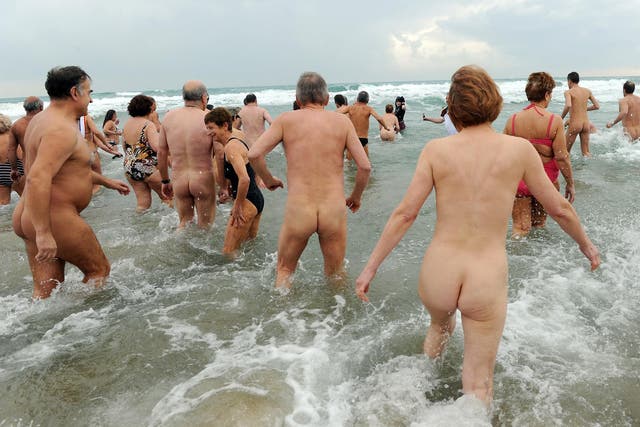 File photo: Nudists take part in the traditional New Year's Eve dip on Cap d'Adge beach