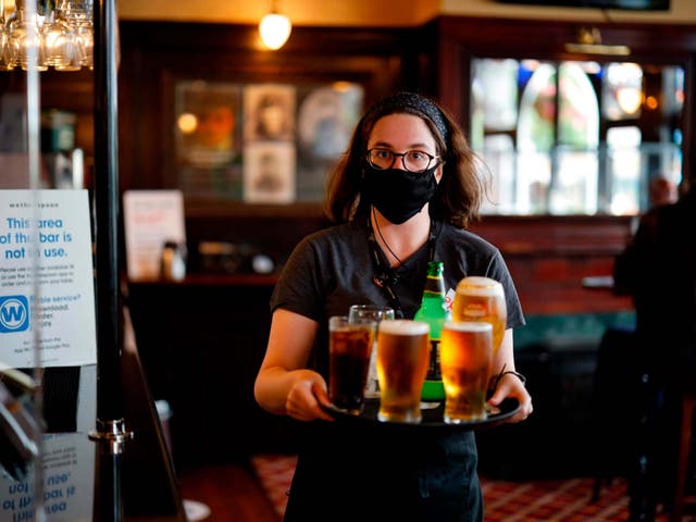 A member of staff inside a Wetherspoon in Stratford, east London
