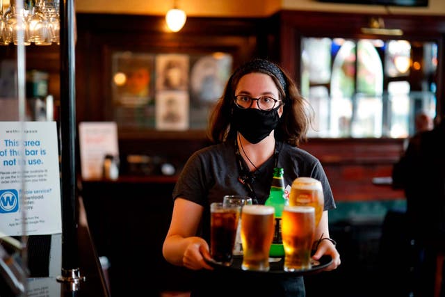 A member of staff inside a Wetherspoon in Stratford, east London