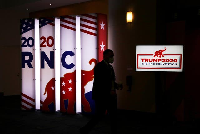 An RNC sign glows outside the Charlotte Convention Centre's Richardson Ballroom where delegates will gather for the roll call vote to renominate Donald J. Trump to be President of the United States and Mike Pence to be Vice President at the Republican National Convention at the Charlotte Convention Centre on 24 August 2020 in Charlotte, North Carolina