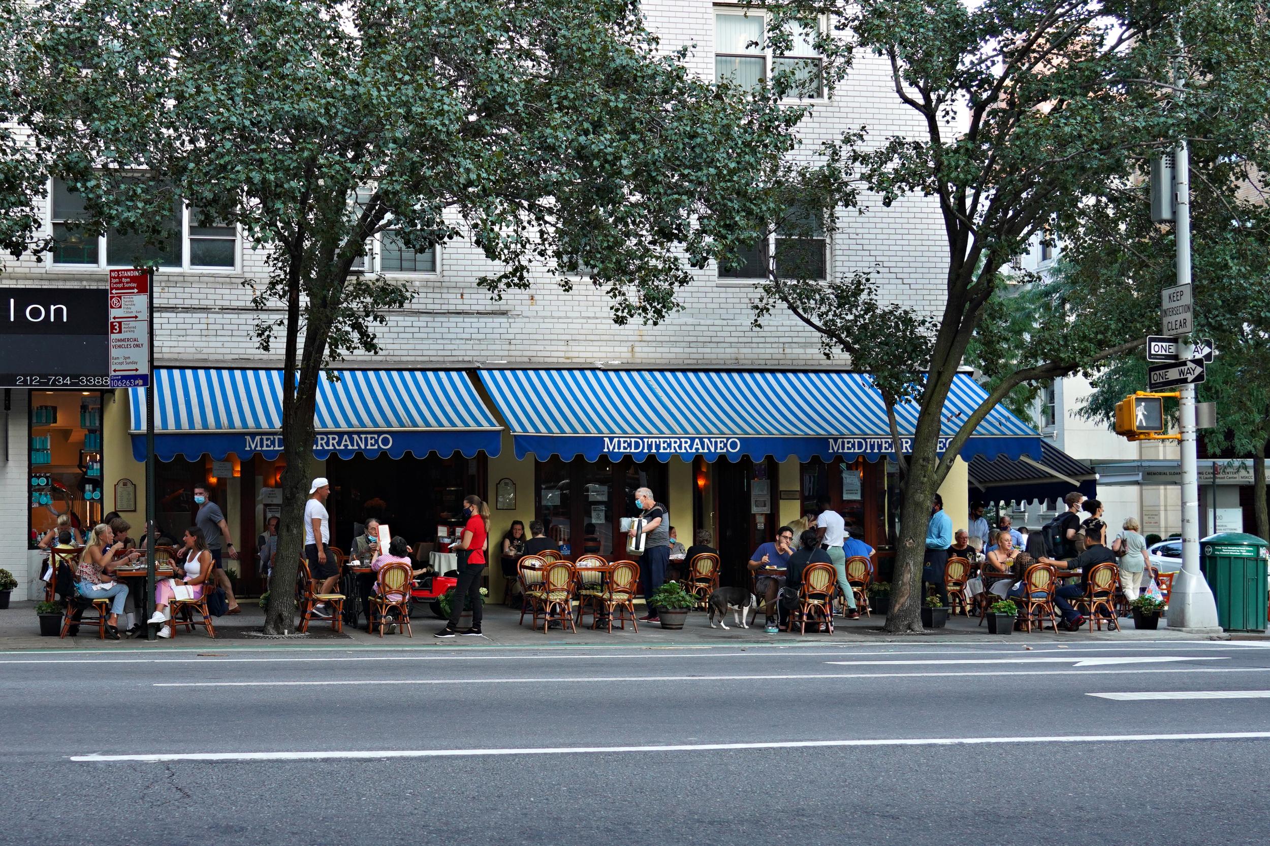 A restaurant offers outdoor dining as New York City continues phase four of re-opening during the coronavirus pandemic, on 22 August 2020. The fourth phase allows outdoor arts and entertainment, sporting events without fans and media production.