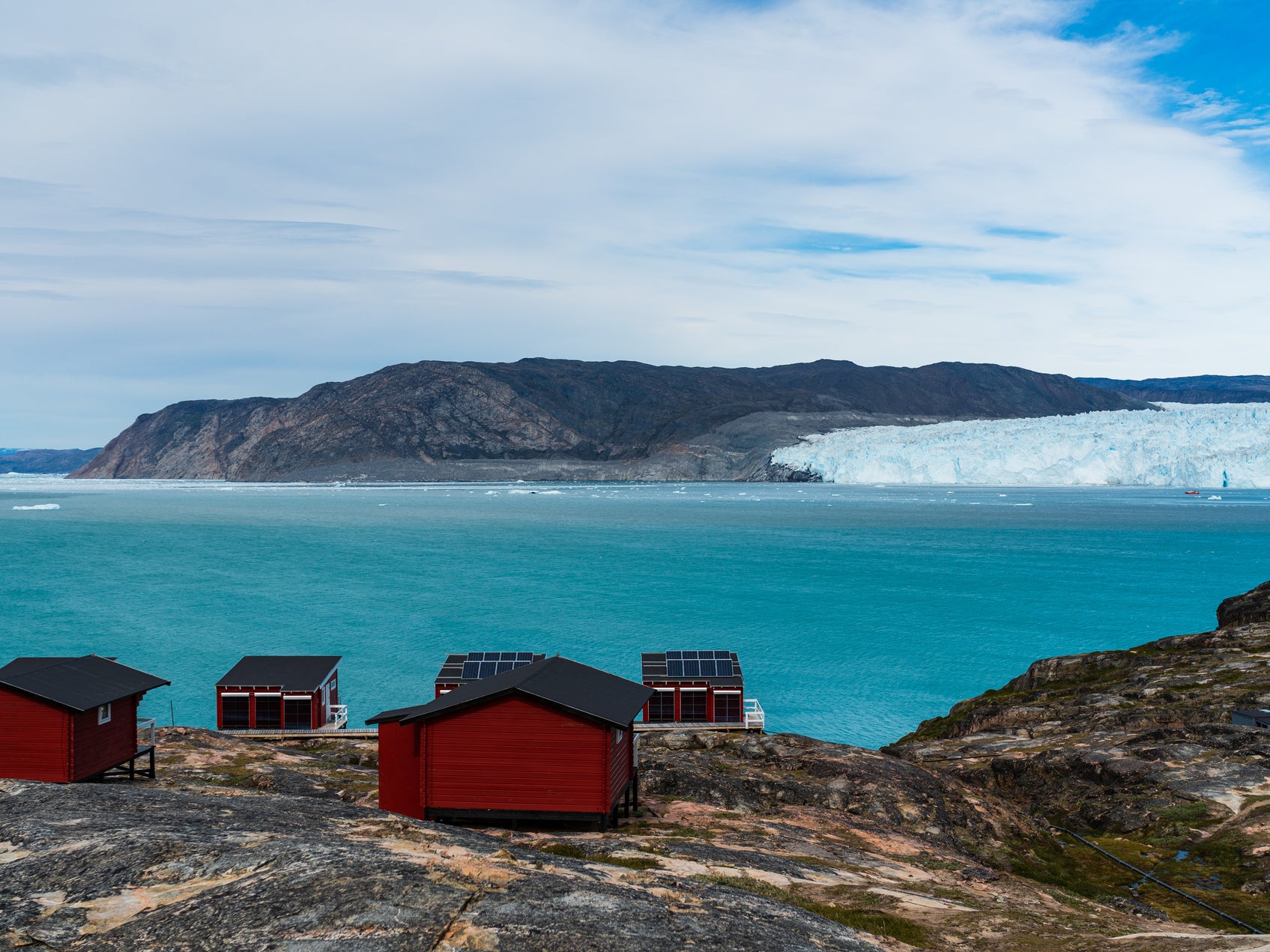 Greenland's famous Eqi glacier. The ice sheet covering most of the island contains enough ice to raise global sea levels by over 7 metres if it all melted