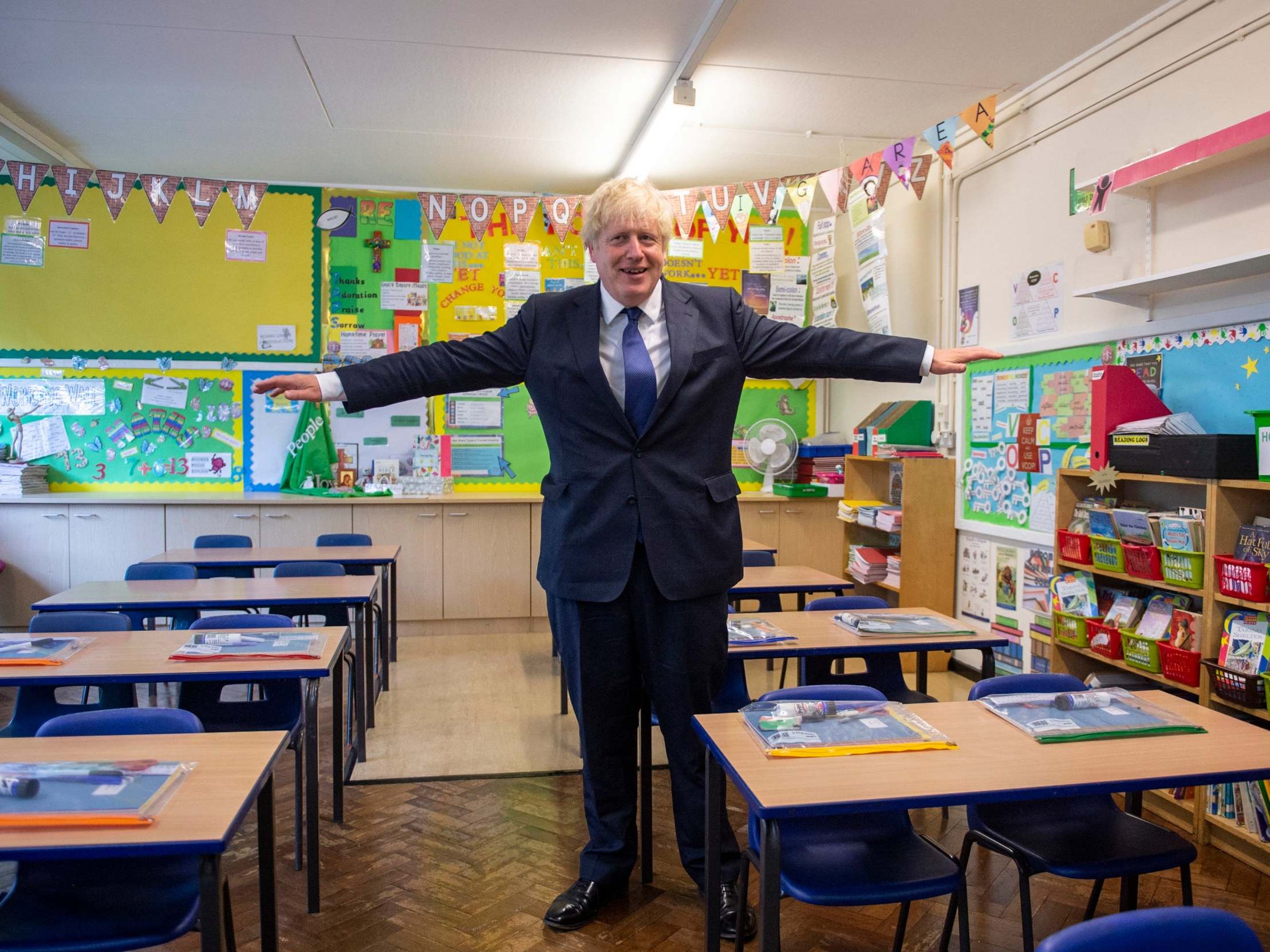 Boris Johnson visits St Joseph’s primary school in London to see the steps they are taking to be Covid-secure (AP)