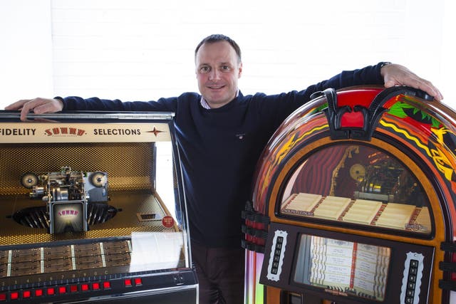 Chris Black with his beloved jukeboxes