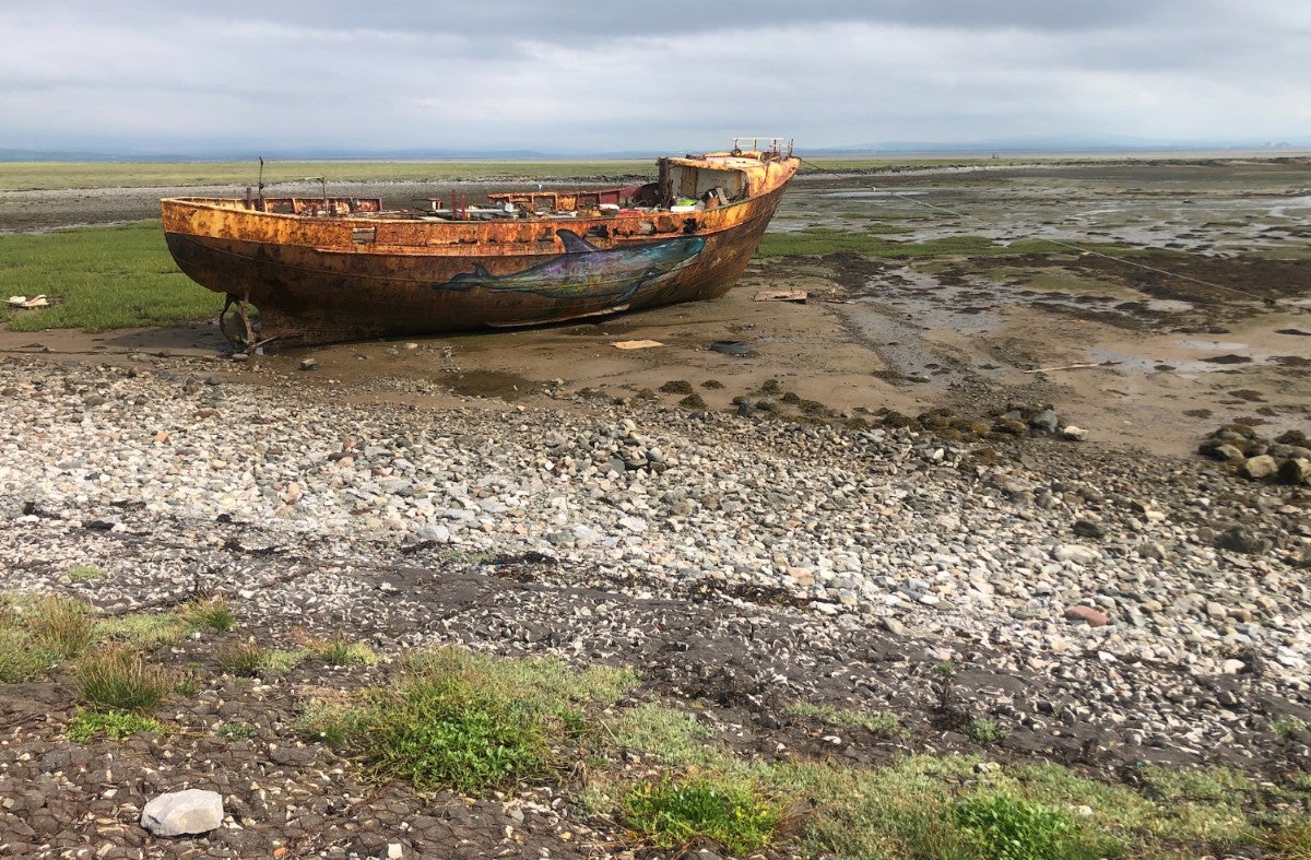 A lone vessel on a lonelier stretch of bay