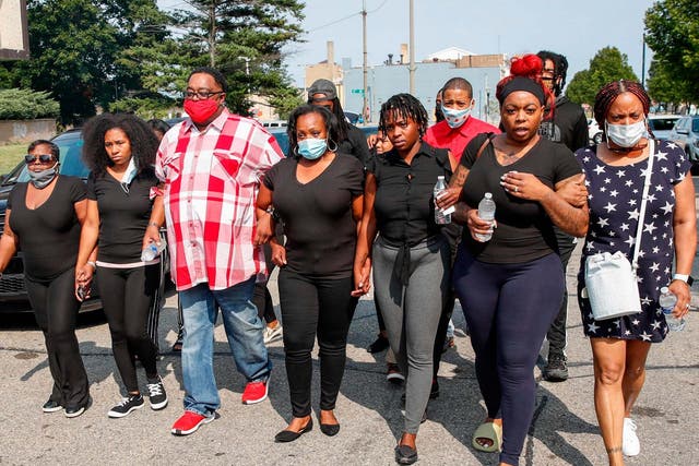 The family of Jacob Blake, who was shot seven times by police officers in Kenosha, Wisconsin, arrive at a press conference