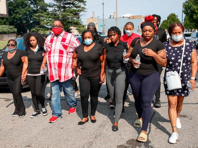 The family of Jacob Blake, who was shot seven times by police officers in Kenosha, Wisconsin, arrive at a press conference