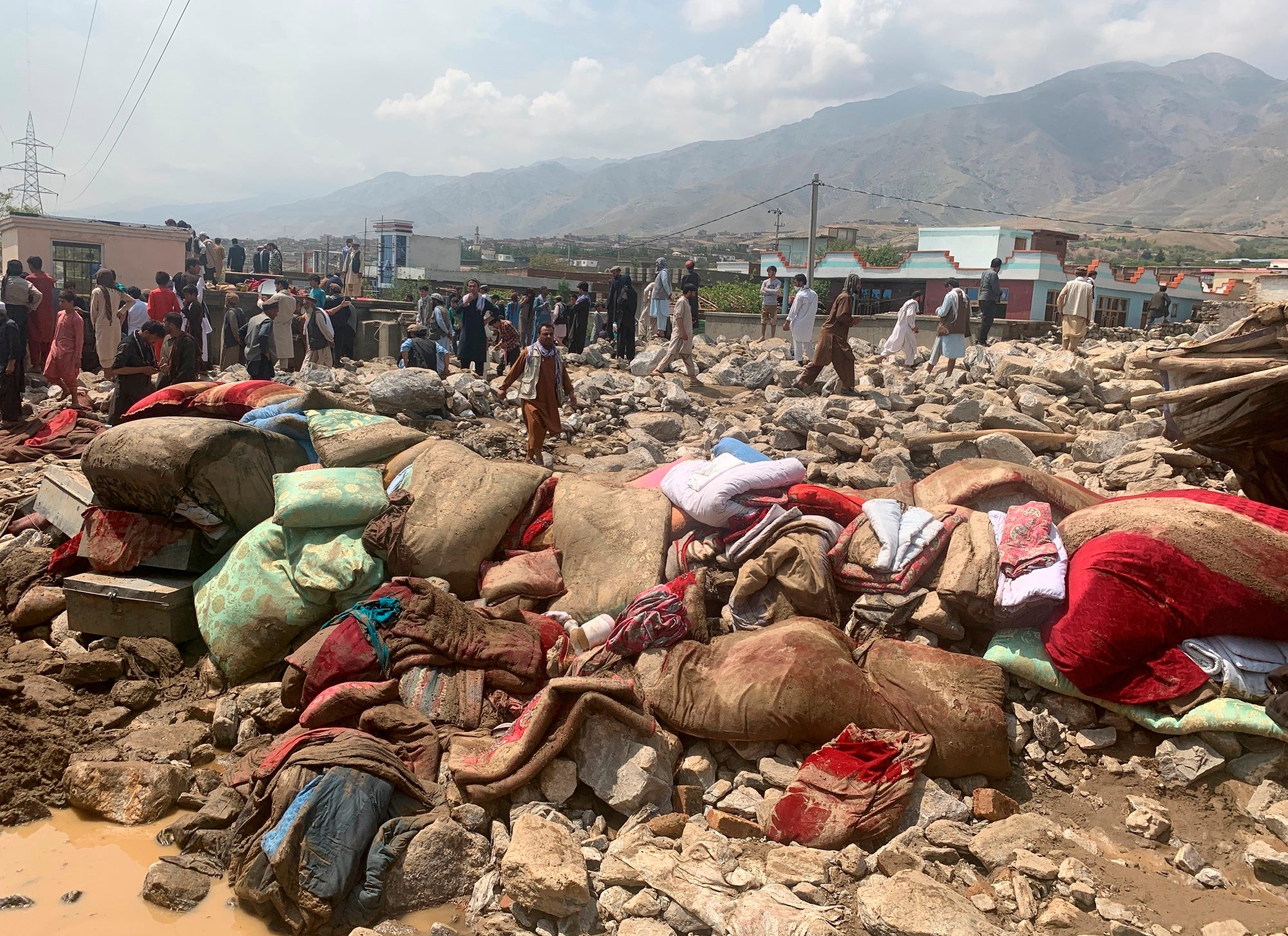 Afghans rescue people in Charikar of the Parwan province, Afghanistan