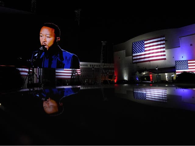 John Legend performs on video for supporters outside the venue where Democratic presidential candidate Joe Biden spoke during the DNC