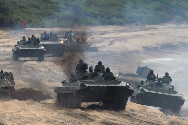 Sri Lankan military personnel in tanks taking part in a training exercise