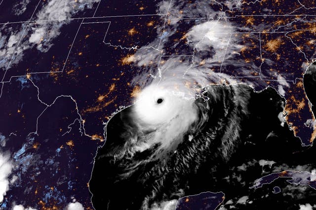 RAMMB/NOAA satellite image shows Hurricane Laura reaching the coasts of Louisana and Texas on August 26, 2020