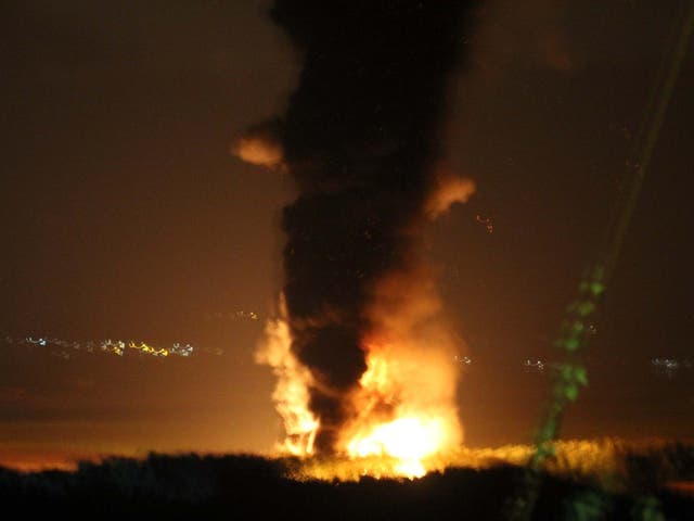 Towering flames and smoke from a large diesel train after it caught fire in Llangennech, near Llanelli, in South Wales