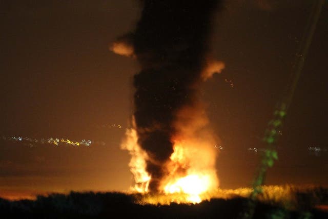 Towering flames and smoke from a large diesel train after it caught fire in Llangennech, near Llanelli, in South Wales