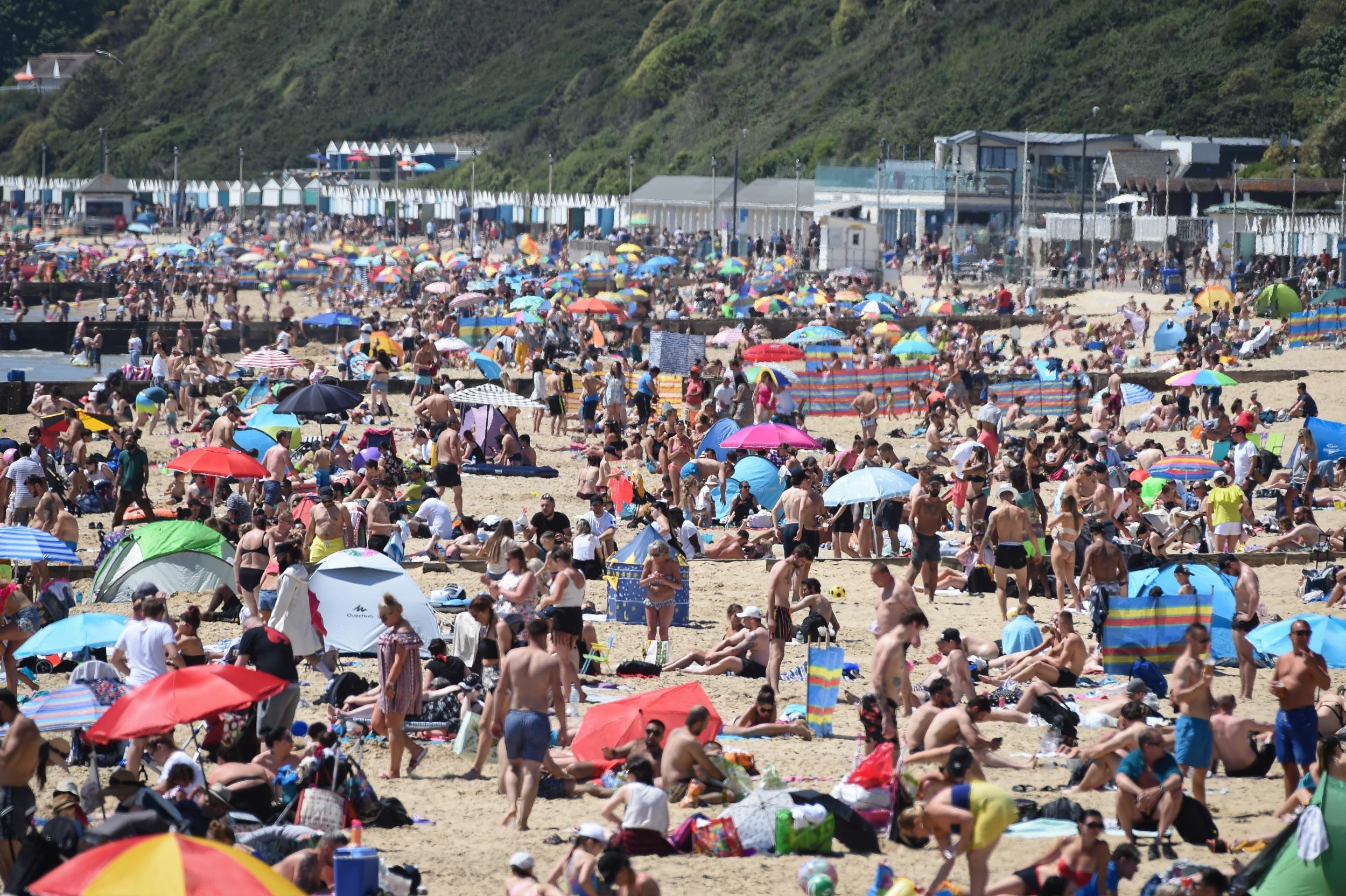 People enjoy the hot weather at Bournemouth beach during the UK's spring bank holiday on May 25, 2020 in Bournemouth (Getty)