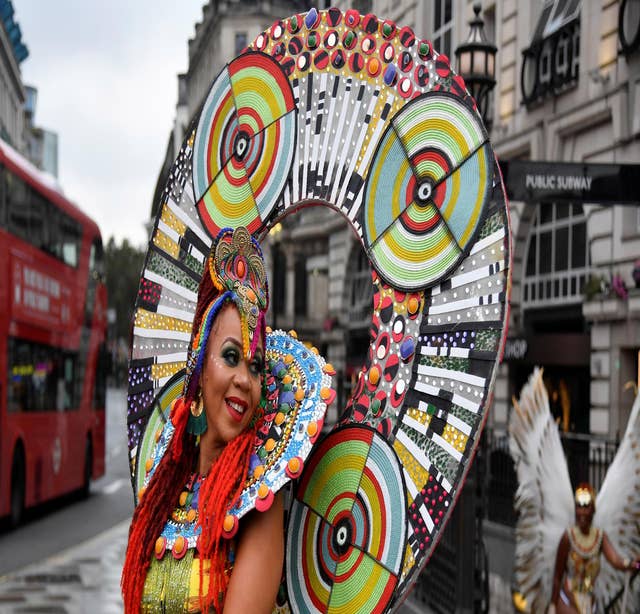 Caribbean soca dancers display their costumes as they promote the first ever digital Notting Hill Carnival, following the cancellation of the normal Carnival festivities due to the continued spread of the coronavirus disease, in London