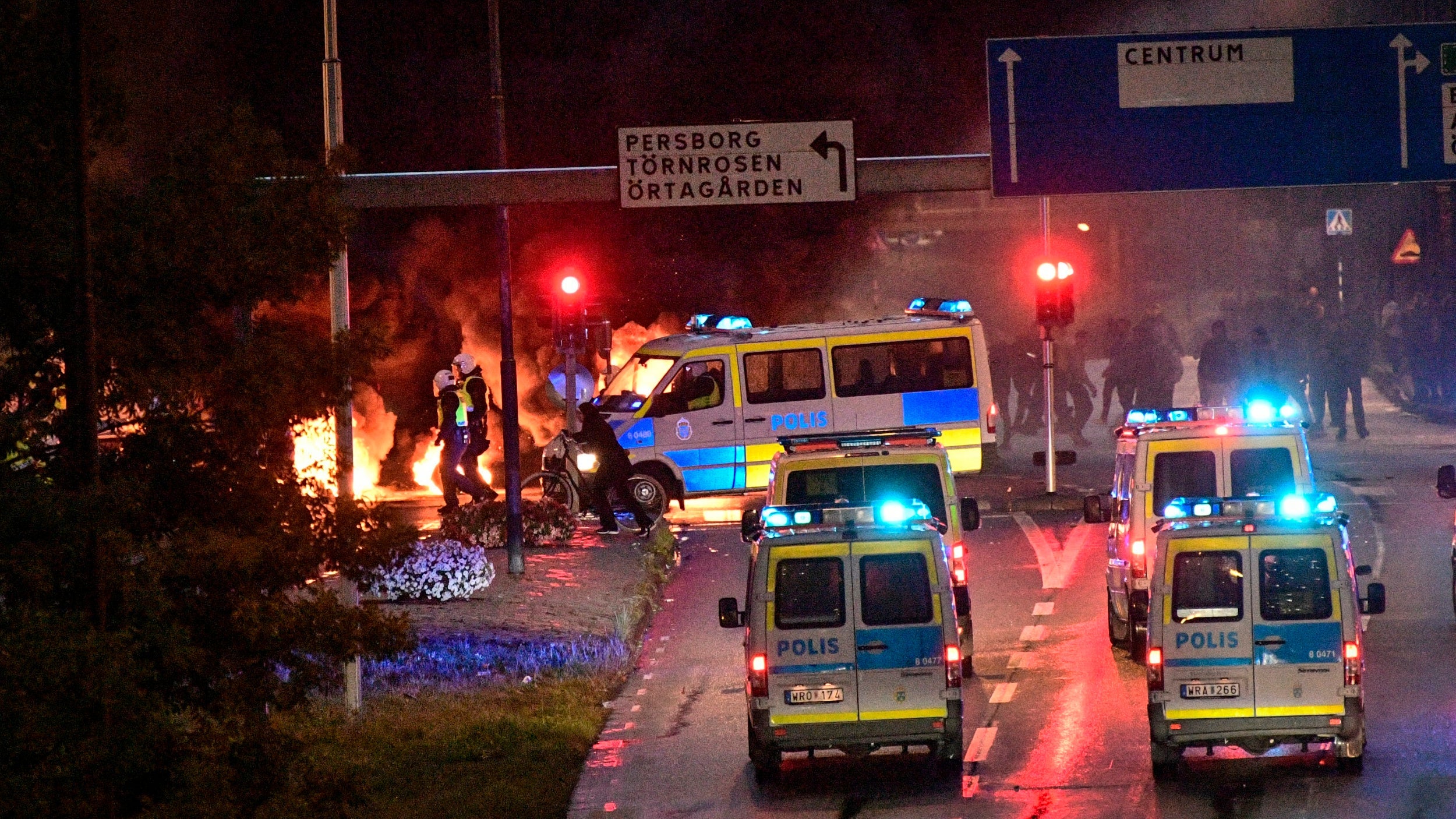 Police said rioters pelted emergency service personnel as fires raged