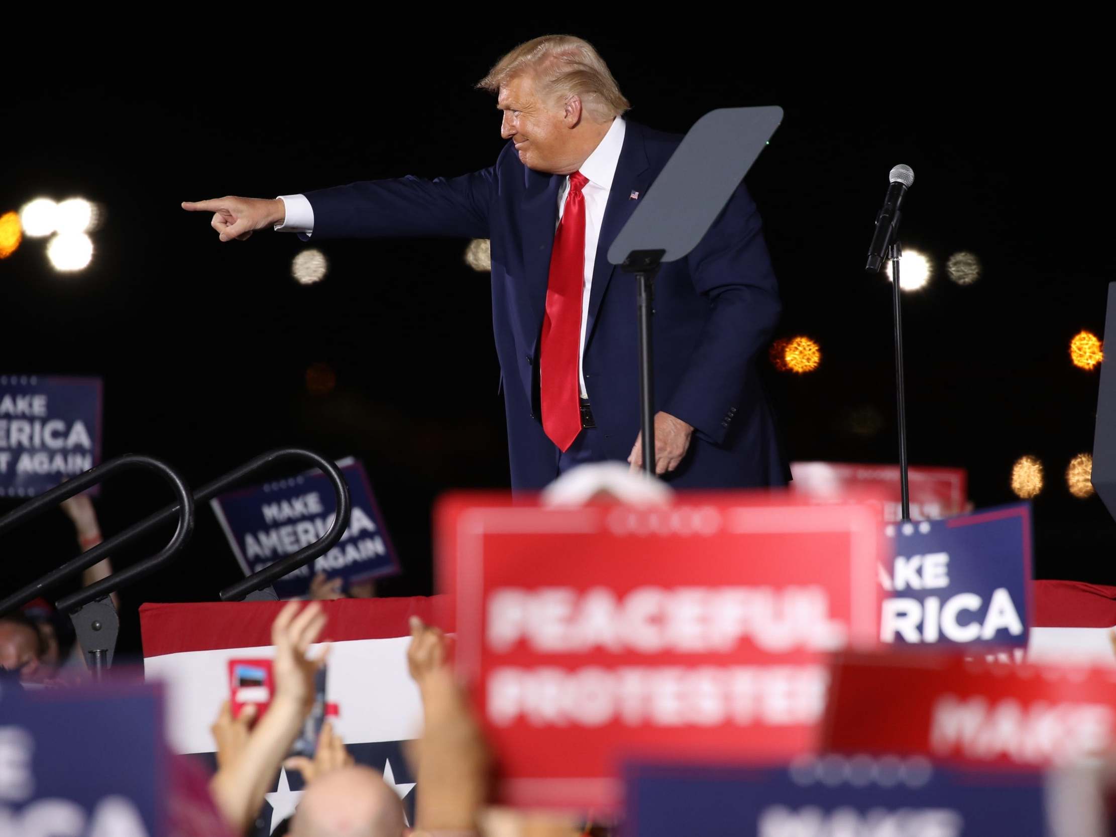 US president Donald Trump speaks at an airport hanger during a rally a day in Londonderry, New Hampshire, 28 August 2020.