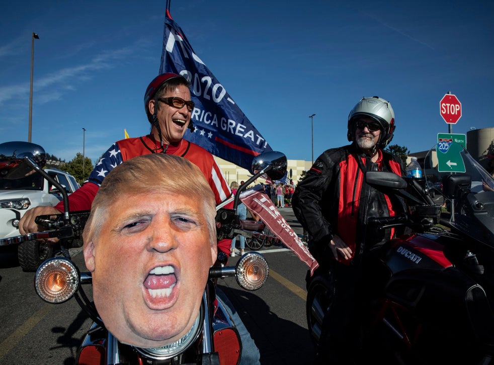 Supporters of President Donald Trump attend a rally and car parade Saturday, Aug, 29, 2020, from Clackamas to Portland, Oregon