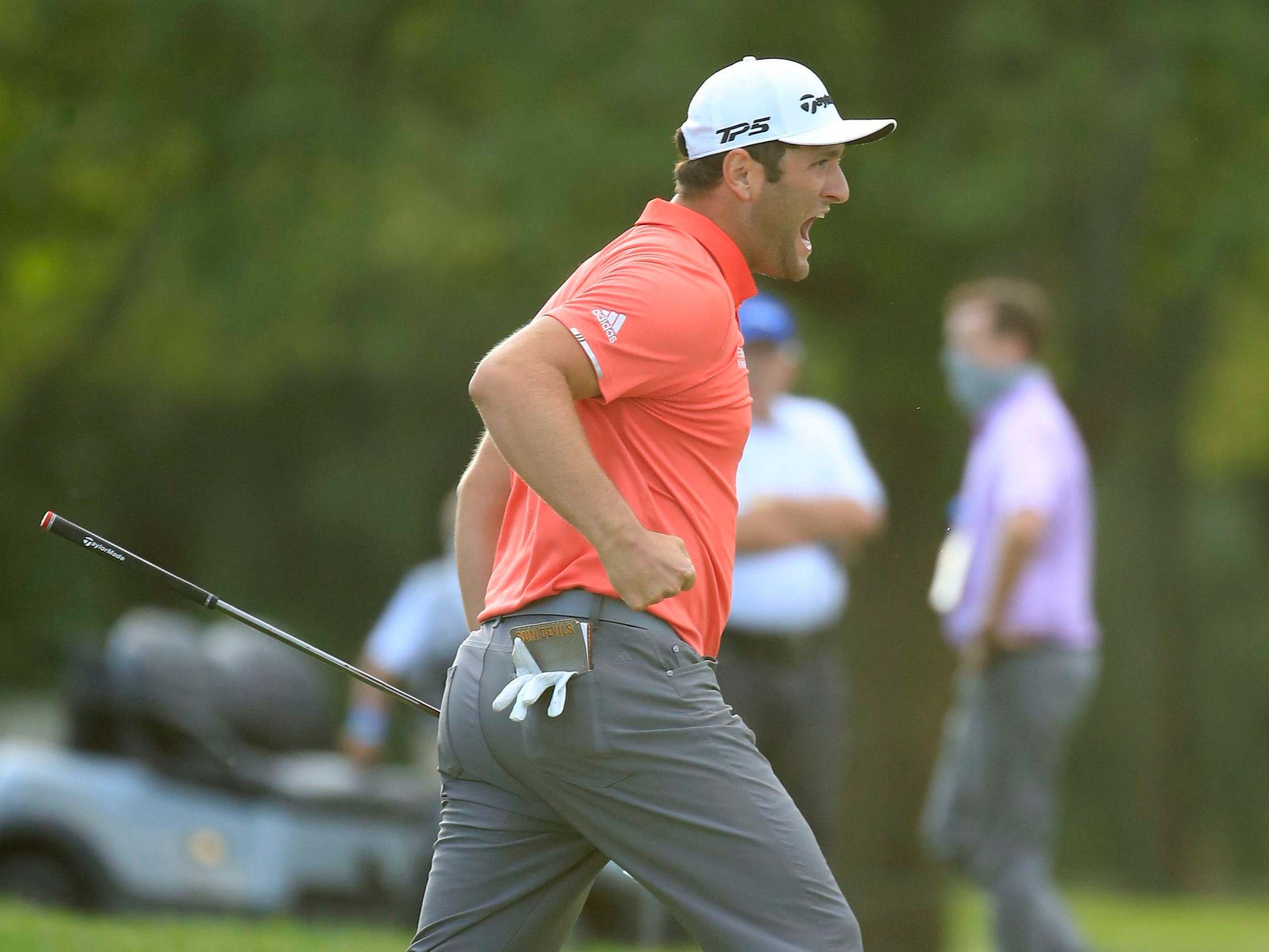 Jon Rahm celebrates his 66-foot putt