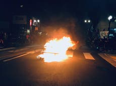 Portland police declare riot after fire started outside mayor’s home