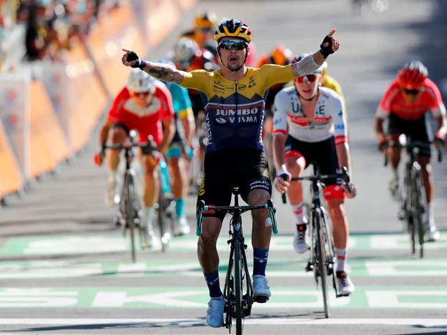 Primoz Roglic celebrates as he crosses the finish line