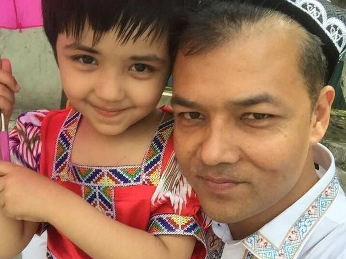 Imin and his daughter, who was recently reunited with her mother in Xinjiang