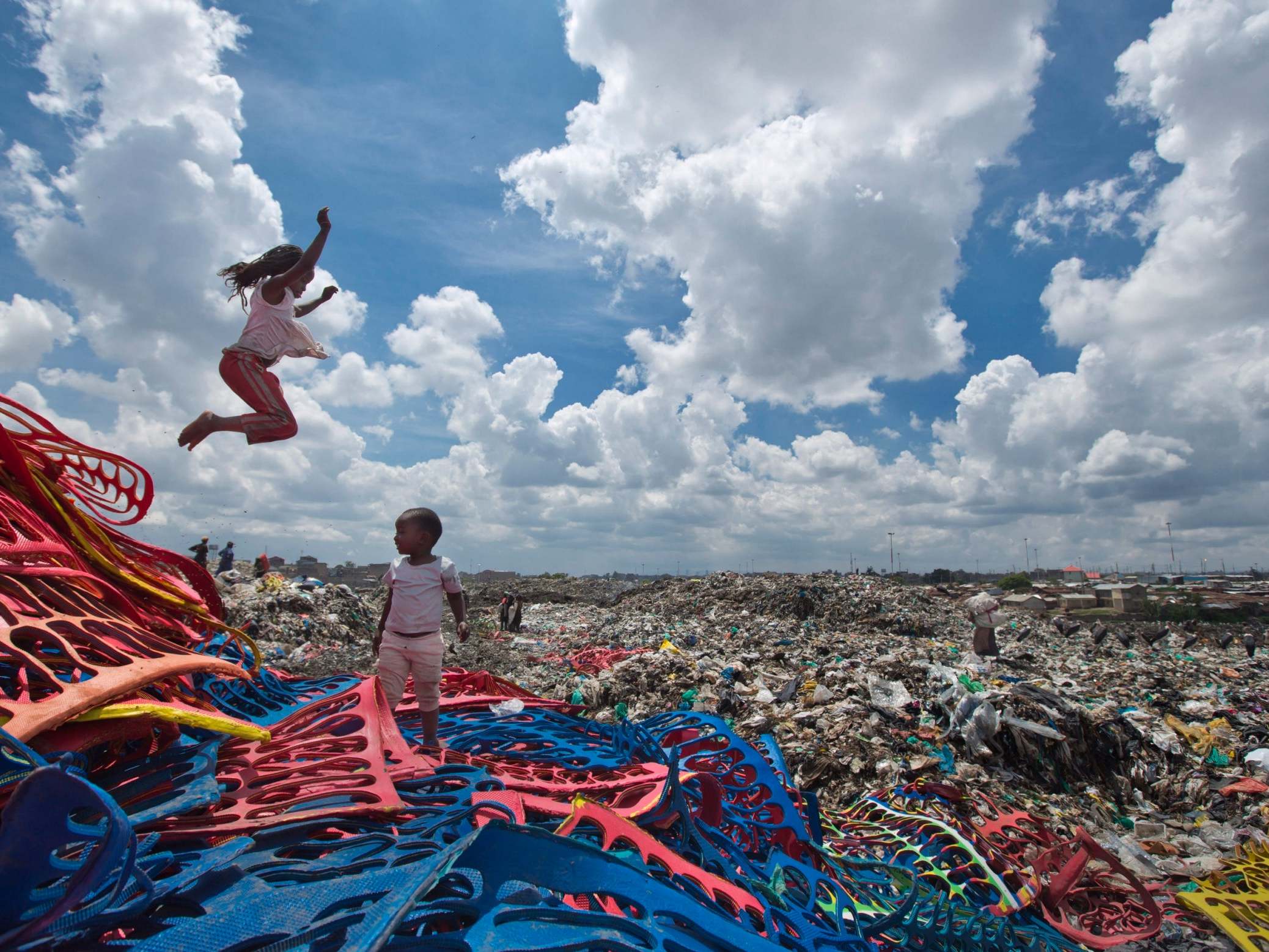 Two children play on a plastic dump in the Dandora slum of Nairobi, Kenya, before a ban on plastic bags came into force in Kenya in 2017. The oil industry has recently asked the US to pressure Kenya to change its world-leading stance against the plastic waste that litters Africa, according to environmentalists